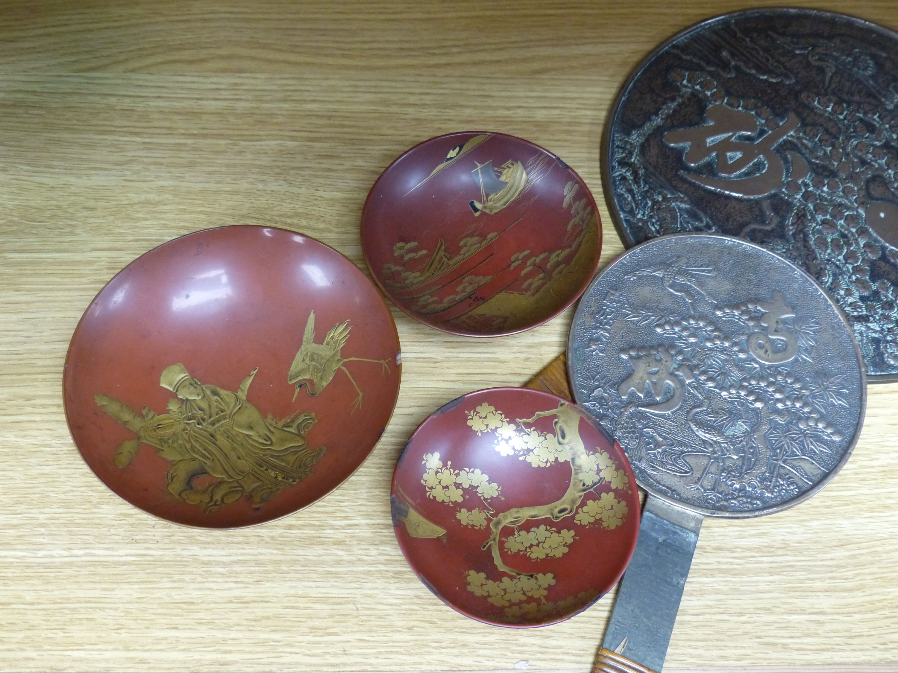 A Japanese lacquer makie three set of bowls and two mirrors, Edo to Meiji, tallest 32cm